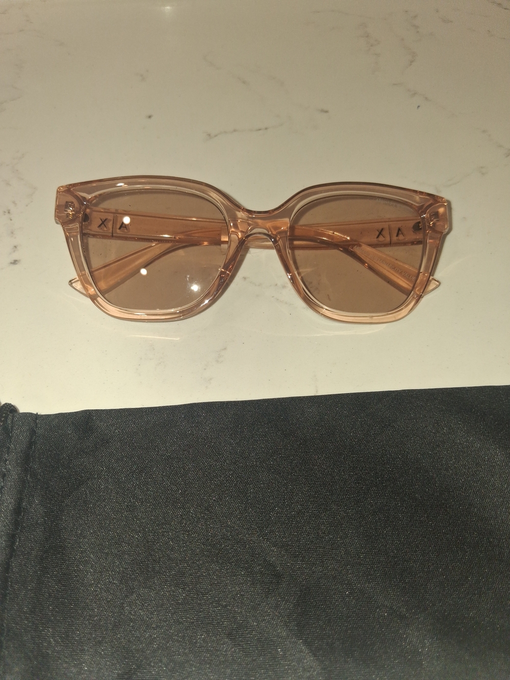 Armani Exchange Women's Sunglasses, model AX4164SU, featuring a transparent peac